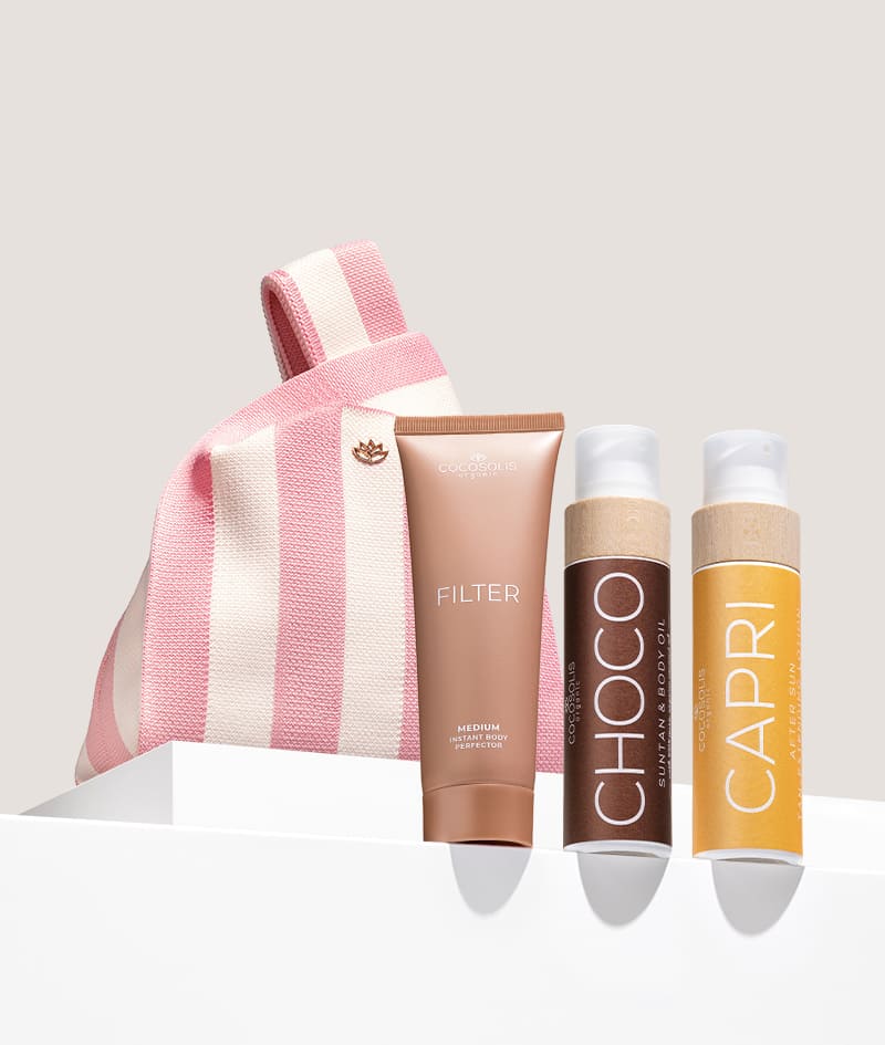 VACATION TRIO + GIFT: El trío que querrás en tu maleta este verano. El aceite bronceador CHOCO acelera el desarrollo de un bronceado natural y deja un irresistible aroma a chocolate. CAPRI calma la piel después de la exposición al sol y prolonga tu bronceado hasta 3 meses después de tu último día de playa. La crema corporal FILTER en un tono medio unifica al instante el tono de la piel, suaviza pequeñas imperfecciones y aporta un brillo sutil y un bronceado bronceado dorado. Gelato Bag es nuestro regalo para ti: hazte con ella antes de que se derrita.